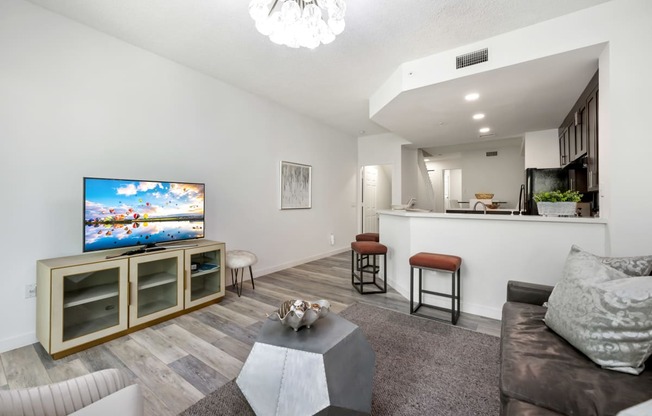 a living room with a couch and a tv