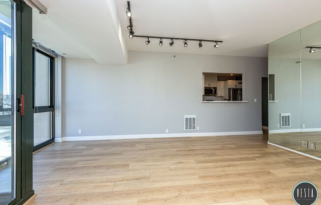 CATHEDRAL HILL: LIGHT FILLED CONDO IN FULL-SERVICE BUILDING W/ IN-UNIT WASHER/DRYER & PARKING INCLUDED