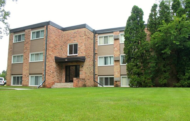 Large Green Yard in Front of Brick Apartment Complex in Minneapolis Minnesota