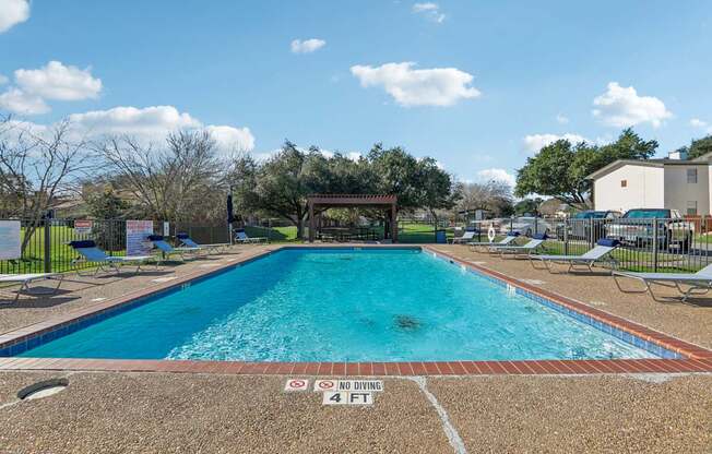 A pool with a no parking sign painted on the ground.