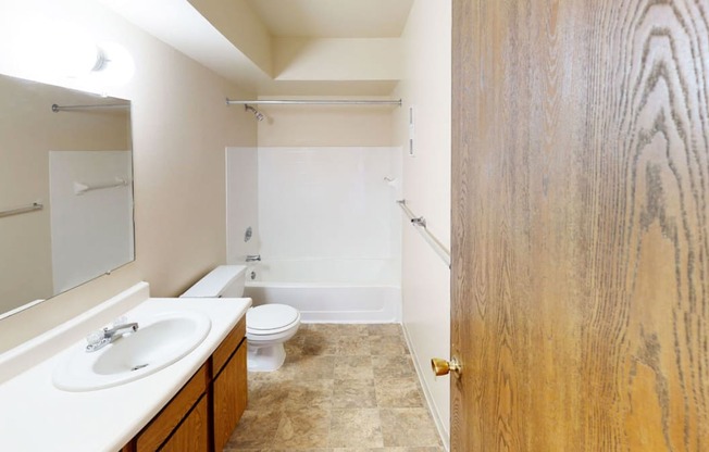 a bathroom with a sink toilet and a shower