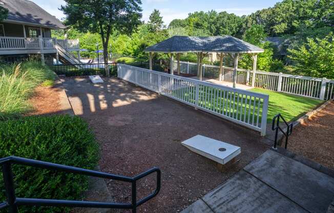 a gazebo in a park next to a house