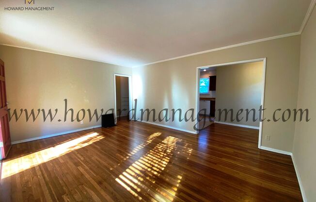 Lovely home with extra large backyard, converted garage and hardwood floors!
