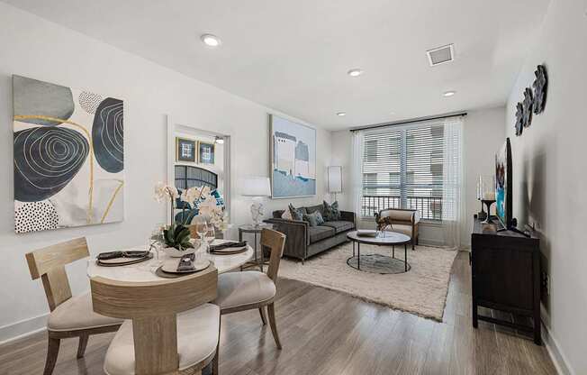 Cozy dining nook with a round table that seamlessly connects to the modern living space