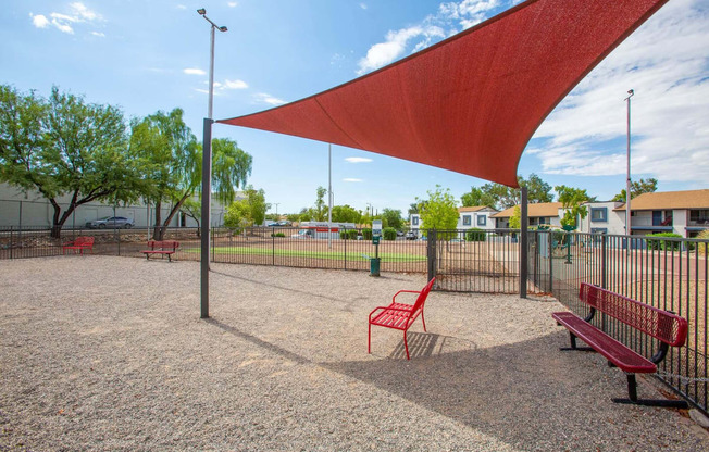 our apartments have a park with benches and a canopy