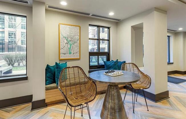 a living room with a table and chairs and a couch