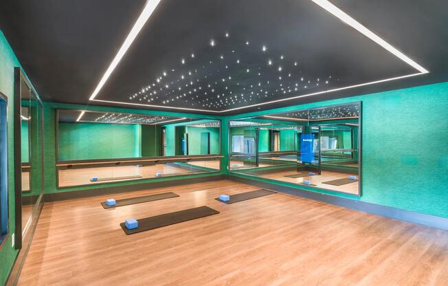 Find your flow in the dedicated yoga and wellness studio—complete with mirrored walls, soft lighting, and plenty of space to stretch and recharge.