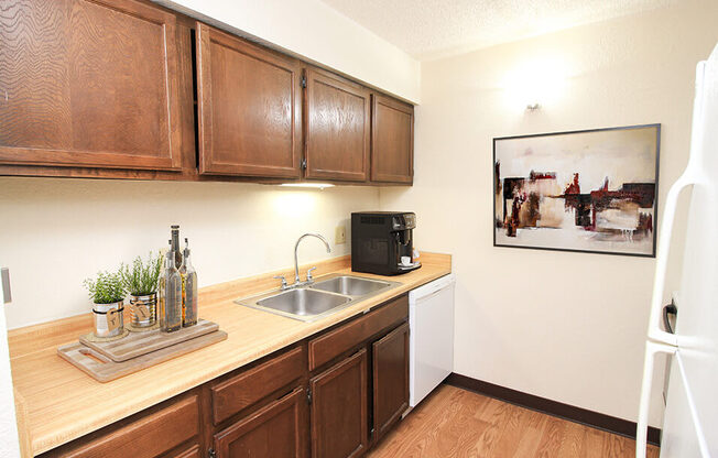 a kitchen with wooden cabinets and a sink