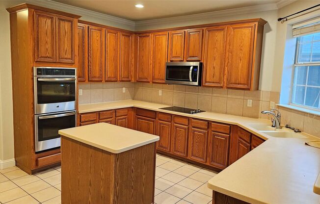This stunning and charming home is located in the Woodbridge community and is ready for move-in.