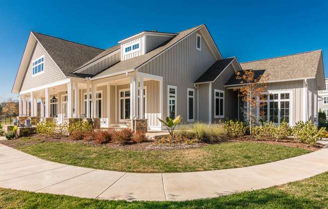 a large house with a sidewalk in front of it at Village at Westland Cove Apartments, Knoxville, TN, 37922