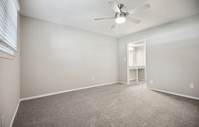 an empty room with carpet and a ceiling fan at Shellbrook, North Carolina, 27609