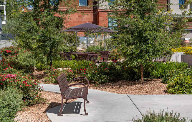 a bench sitting on a sidewalk in front of a building