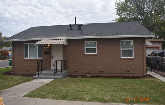Darling Two Bedroom Home with all New Carpet/ Paint/ Dual Pane Windows/ Garage