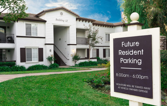 Resident parking sign and building exterior