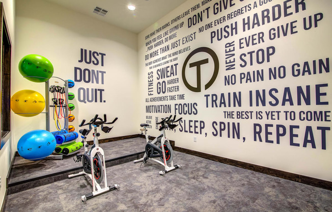 a wall in the gym with motivational quotes