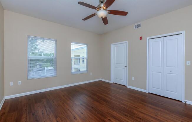 a living room with hard wood floors