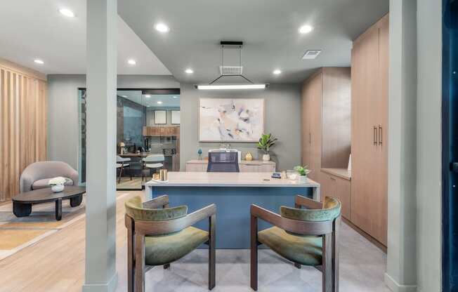 a dining room with a blue counter and chairs