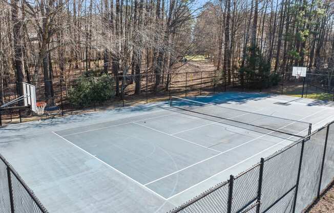 the tennis court is clean and ready for the kids to play