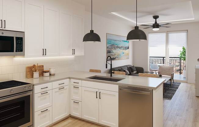 an open kitchen and living room with white cabinets and stainless steel appliances