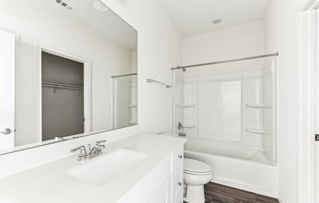 Clean and modern bathroom with a vanity and shower of Dogwood floor plan at Beacon at Presidential Heights in Manor, TX