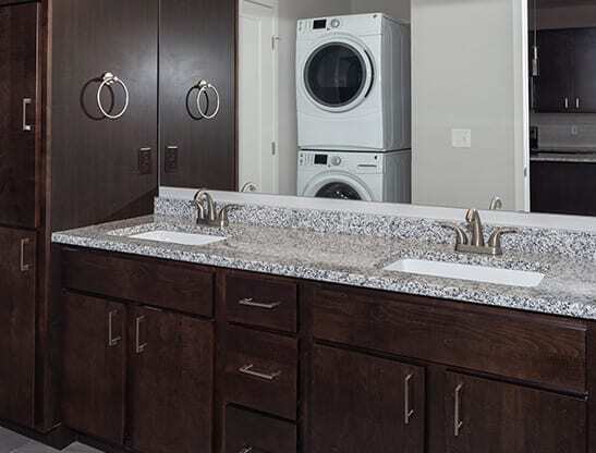 a bathroom with a sink and a washer and dryer