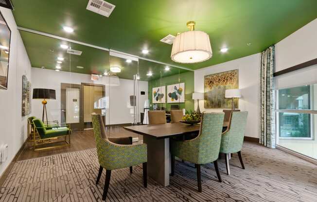 a dining room with a table and chairs