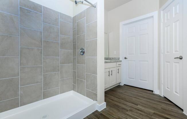 Apartments in Leander TX - Hills at Leander Expansive Bathroom with a Large Vanity, Shower, and Much More