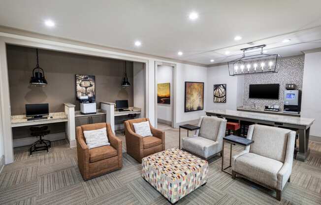 a living room with chairs and a desk and a television