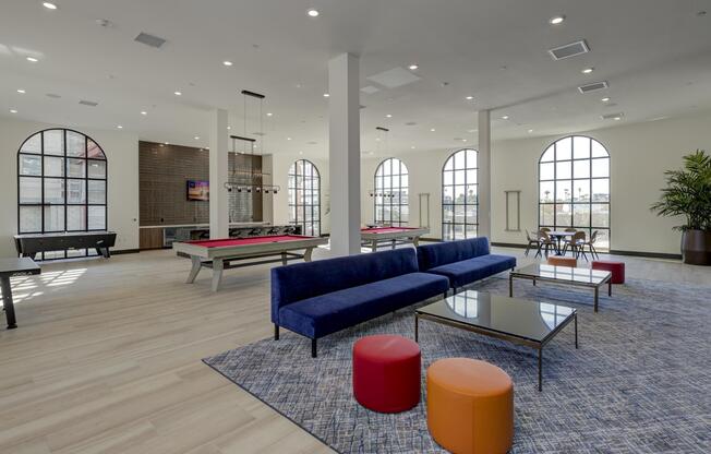 a living room filled with furniture and a large window