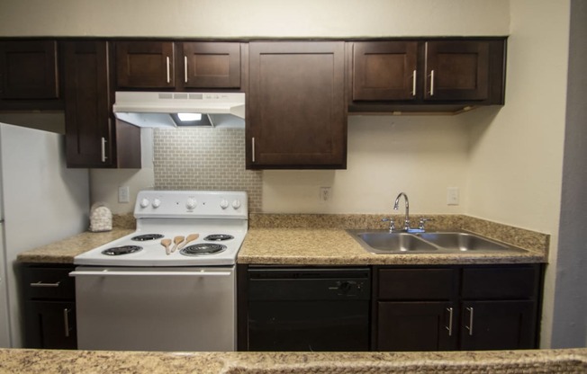 This is a photo of the kitchen of a fully upgraded 554 square foot 1 bedroom apartment at The Biltmore Apartments in Dallas, TX.