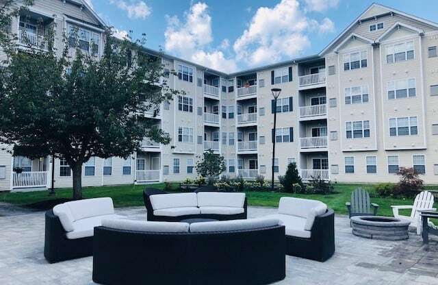 Outdoor patio with lounge seating | Highlands at Faxon Woods