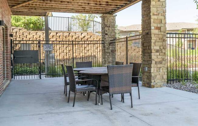 Outdoor seating by pool at Villas of Omaha in northwest Omaha NE 68116