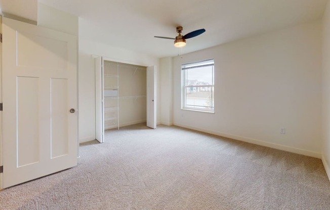 Spacious Bedroom with Large Closet at The Reserve at Destination Pointe in Grimes, IA with