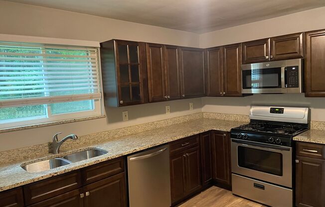 Cozy 2-Bedroom Home with Basement, Garage, and Fenced Backyard!