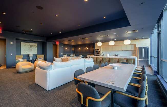 a living room and dining room with couches and a table