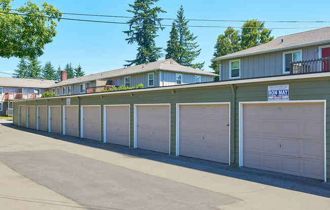 a row of garages with white garage doors in front of houses  at Woodhaven, Everett, WA