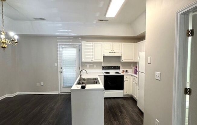 Close to Downtown Greer - this is a Fantastic 2 Bedroom, 2.5 Bathroom end unit condo that offers tons of storage and open space.