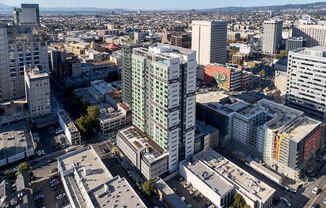A cityscape with a mix of modern and older buildings.