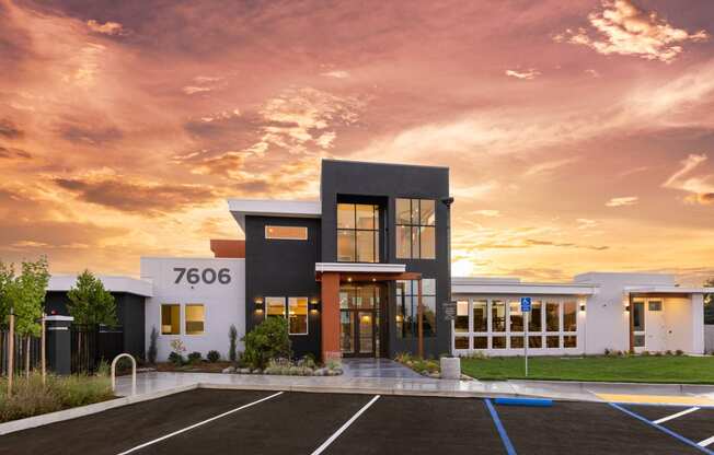 leasing office and clubhouse exterior with sunset in the background at Solasta, Sacramento, CA, 95831