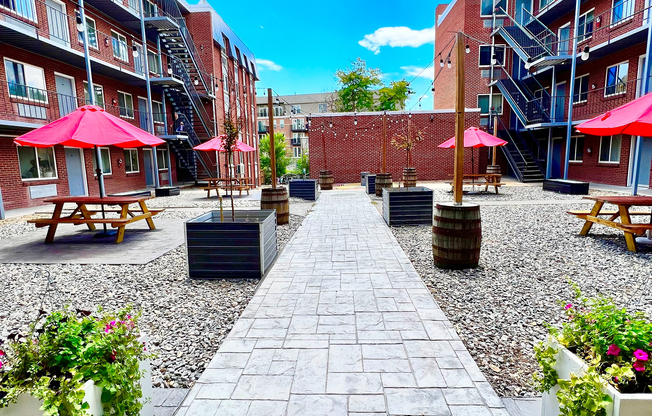 Experience serene outdoor living in this inviting courtyard, ideal for relaxation and social gatherings.