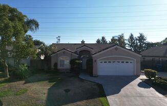 A charming 3-bedroom, 2-bathroom home for rent in a peaceful Bakersfield neighborhood