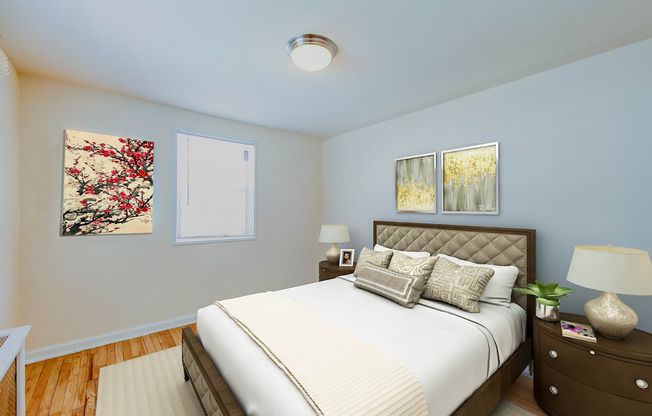 bedroom with bed, night stand, hardwood floor and modern lighting at garden village apartments in congress heights washington dc