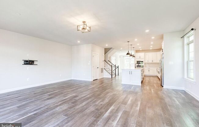 Welcome to this nearly new, 3bd 3.5bth end-unit home!