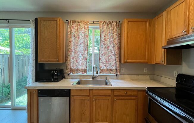 Beautiful Two-Level Townhouse with Gas Fireplace, Vaulted Primary Suite, and Fenced Backyard!