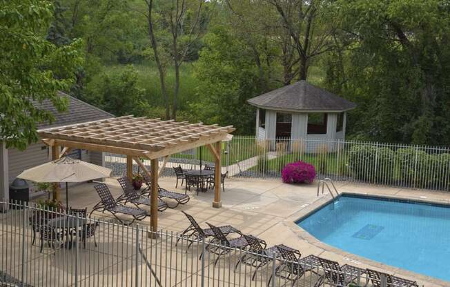 Outdoor pool with lounge chairs and sun terrace