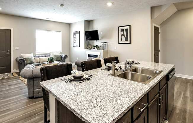 Luxury studio, one, and two bedroom apartment homes featuring granite countertops, stainless steel appliances, and fireplaces at East Lake Flats in Lincoln, NE