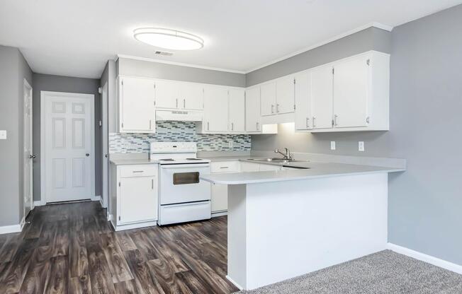 a kitchen with a stove and a refrigerator