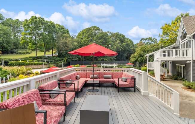 Outdoor living room with comfortable seating at The Berkshires at Vinings apartments