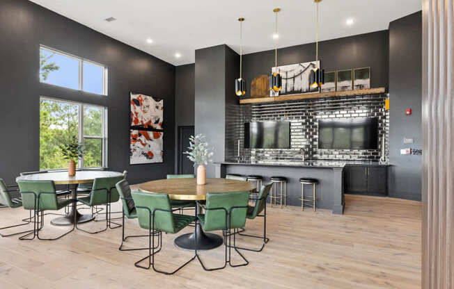 A modern dining room with a bar area and a television.