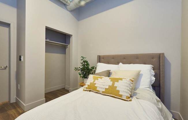 Bedroom with cozy bed at Brickside Heights Apartments, Millcreek, UT, 84106